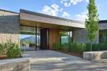 Experience modern luxury in this stunning home featuring expansive glass walls that seamlessly blend indoor and outdoor living.