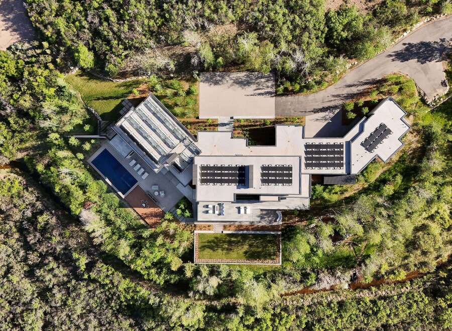 Experience luxury living in this stunning modern estate, featuring a sleek design and an array of upscale amenities.