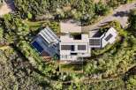 Experience luxury living in this stunning modern estate, featuring a sleek design and an array of upscale amenities.