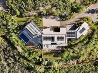 Experience luxury living in this stunning modern estate, featuring a sleek design and an array of upscale amenities.