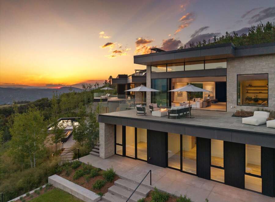 Experience luxury living in this modern architectural masterpiece, boasting expansive glass walls and multiple levels of outdoor entertaining space.