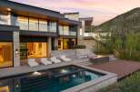 Experience luxury mountain living in this stunning modern estate, featuring a sleek infinity pool and spa overlooking a serene landscape.