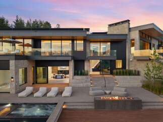Experience luxury living in this modern architectural masterpiece, featuring expansive glass windows and sleek lines.