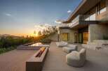 Experience luxury living with this stunning modern home featuring a sleek infinity pool and a captivating fire pit, perfect for evening relaxation.