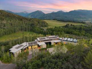 Experience luxury mountain living in this stunning contemporary estate, nestled amidst a serene forest with breathtaking panoramic views.