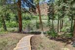 Discover this stunning property with a scenic pathway leading to a tranquil river.