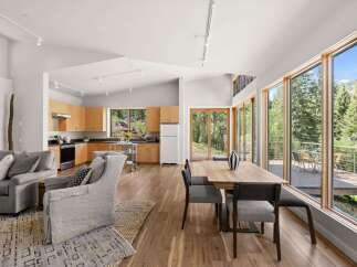 Experience modern living in this open-concept home, featuring a gourmet kitchen with ample cabinetry and a spacious dining area perfect for entertaining.