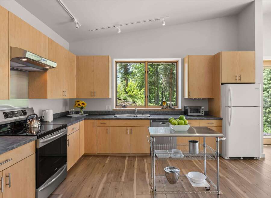 Experience the perfect blend of modern design and natural beauty in this stunning kitchen.