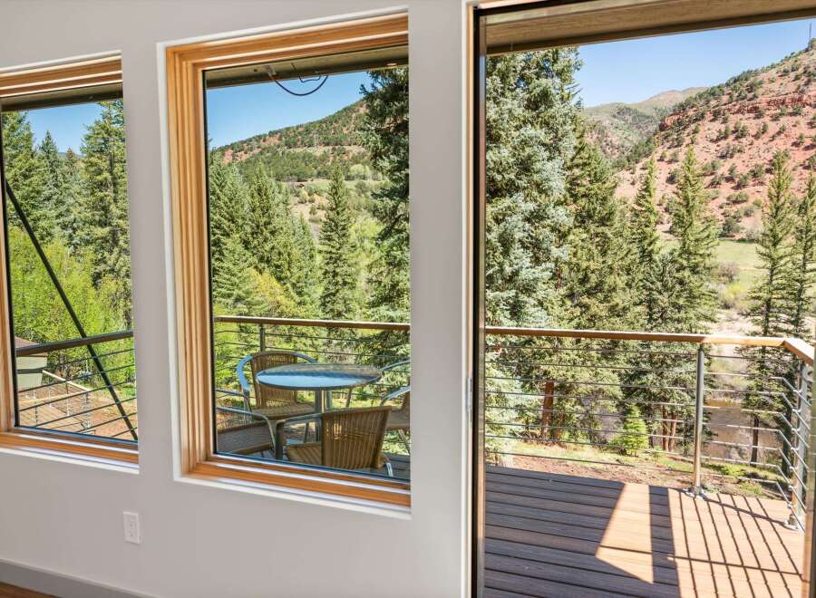 Experience breathtaking mountain views from this stunning property, featuring expansive windows that bring the outdoors in.