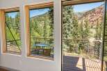 Experience breathtaking mountain views from this stunning property, featuring expansive windows that bring the outdoors in.