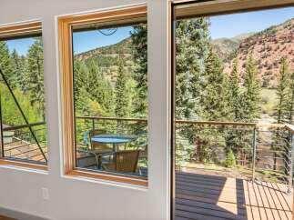 Experience breathtaking mountain views from this stunning property, featuring expansive windows that bring the outdoors in.
