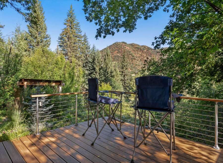 Enjoy breathtaking mountain views from this expansive deck, perfect for outdoor relaxation and entertaining.
