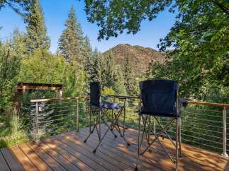 Enjoy breathtaking mountain views from this expansive deck, perfect for outdoor relaxation and entertaining.