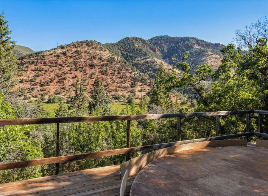 Enjoy breathtaking mountain views from this stunning property's expansive deck.