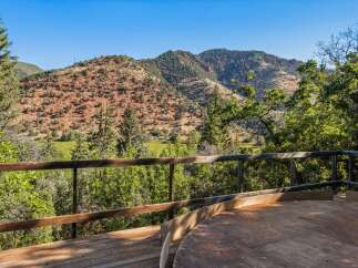 Enjoy breathtaking mountain views from this stunning property's expansive deck.