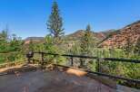 Enjoy breathtaking mountain views from this expansive wooden deck, perfect for outdoor entertaining or quiet relaxation.