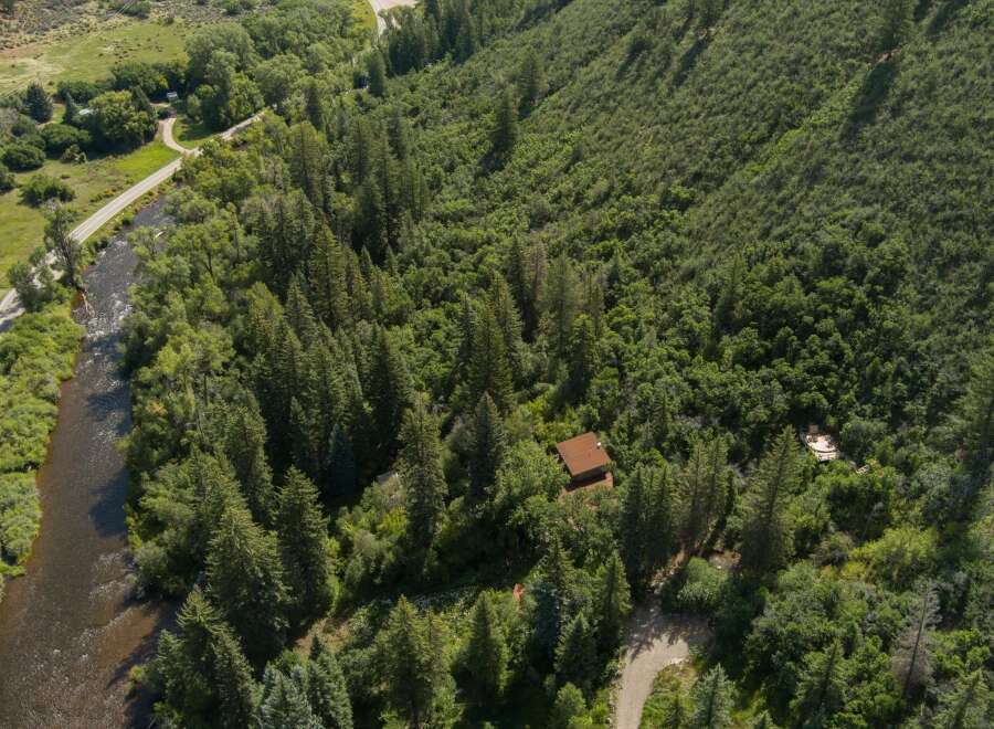 Discover this secluded cabin nestled amidst a lush forest, offering a private retreat with stunning natural surroundings.