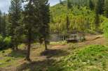 Nestled amidst a lush forest, this modern home offers stunning natural views and a serene living experience.