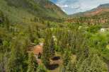 Nestled amidst a lush forest and rolling hills, this property offers a secluded retreat with stunning natural beauty.