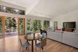 Experience breathtaking mountain views from this stunning living space, featuring expansive windows and a seamless indoor-outdoor flow.
