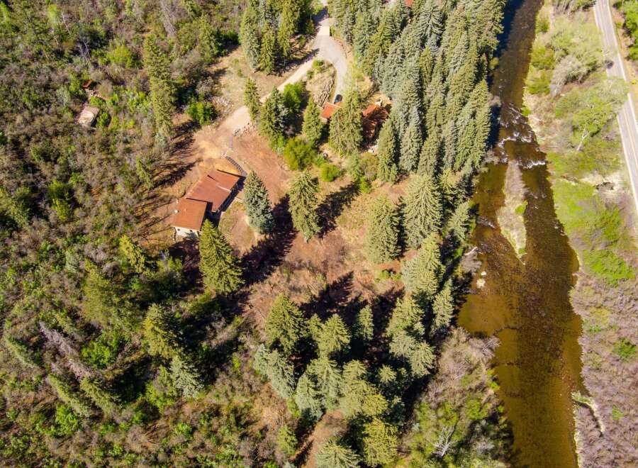 Discover this secluded mountain retreat nestled amongst towering pine trees, offering unparalleled privacy and tranquility.