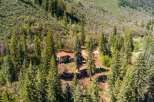 Nestled amidst a lush forest, this secluded home offers a tranquil retreat.