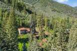 Nestled amidst a lush forest, this secluded home offers a tranquil retreat with stunning natural surroundings.