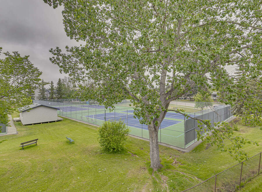 Enjoy outdoor recreation at this property featuring multiple well-maintained tennis courts, perfect for enthusiasts of all levels.