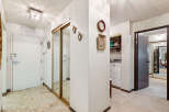 Step into this welcoming entryway featuring a bright white door with modern hardware and a convenient built-in ventilation system.