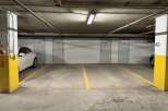 Discover secure and convenient parking in this underground garage, featuring numbered storage units for added convenience.