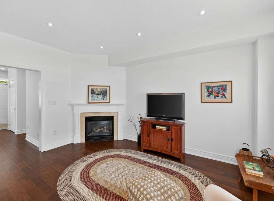 This inviting living room features a cozy gas fireplace as the focal point, perfect for chilly evenings.