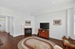 This inviting living room features a cozy gas fireplace as the focal point, perfect for chilly evenings.