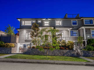 Experience modern living in this stunning townhouse, featuring sleek siding and multiple levels of sophisticated design.
