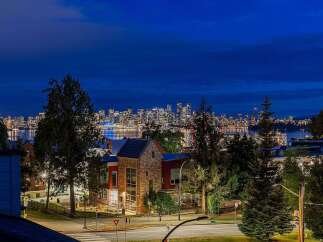 Experience breathtaking city skyline views from this stunning property, perfectly captured at dusk.