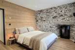 Experience rustic charm and modern comfort in this beautifully appointed bedroom.