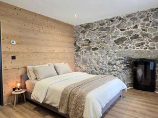 Experience rustic charm and modern comfort in this beautifully appointed bedroom.