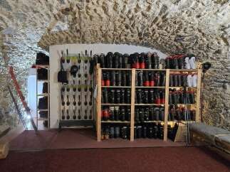 Discover the ultimate ski storage solution in this unique property, featuring a dedicated boot room with ample shelving for ski boots and equipment.
