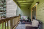 Enjoy the outdoors on this charming covered balcony, perfect for relaxing or entertaining.