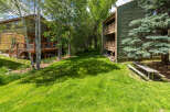 Enjoy the serene mountain setting with this charming property, featuring a spacious wooden deck perfect for outdoor relaxation and entertaining.