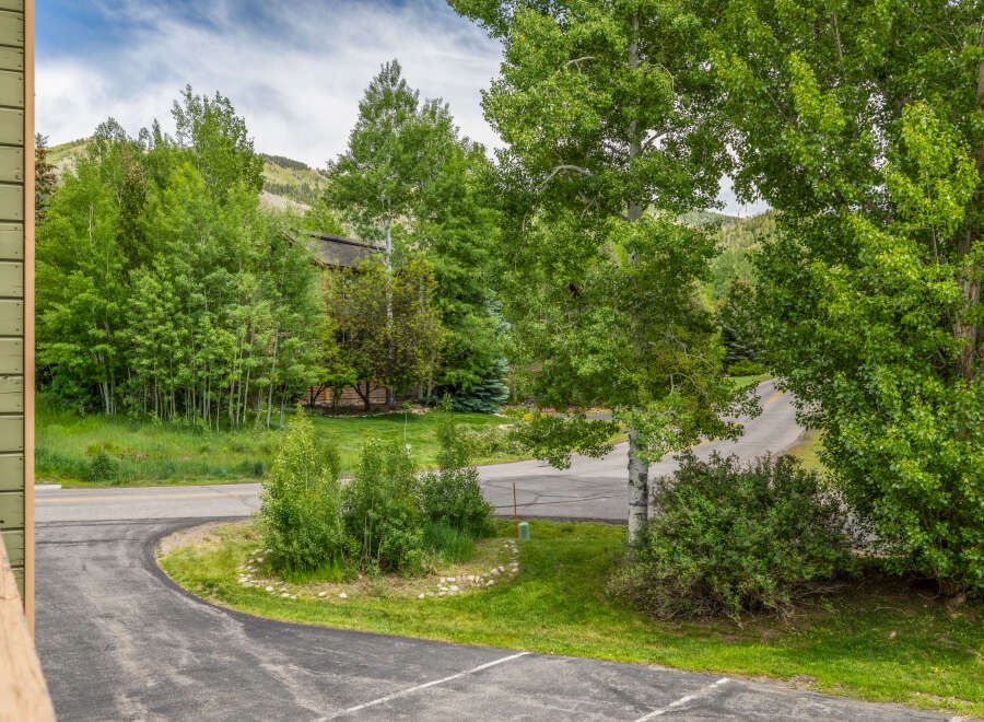 Nestled amidst lush greenery and mature trees, this property offers a serene mountain retreat.
