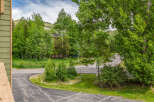 Nestled amidst lush greenery and mature trees, this property offers a serene mountain retreat.