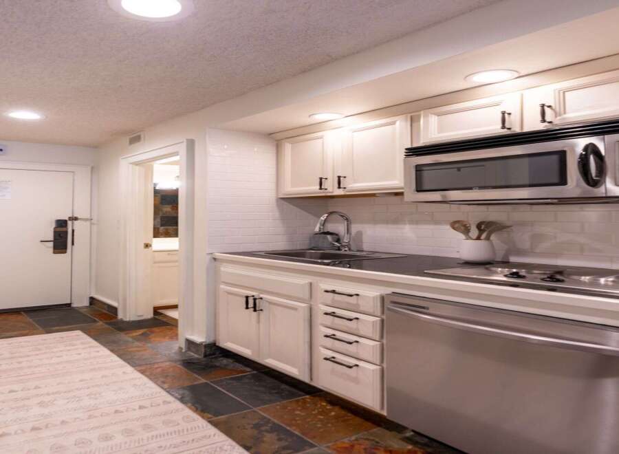 This charming studio apartment features a compact yet fully equipped kitchenette, perfect for preparing meals during your stay.