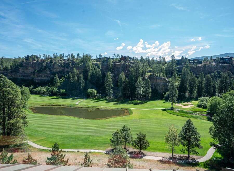 Experience luxury living with this stunning golf course view property, featuring a serene pond and meticulously manicured fairways.