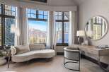 Experience luxury living with breathtaking mountain views from this elegant bedroom.