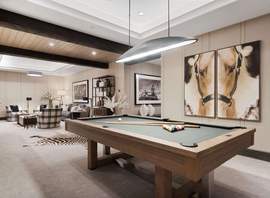 Experience luxury and leisure in this sophisticated game room, featuring a professional billiard table and stylish seating areas.