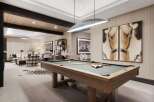 Experience luxury and leisure in this sophisticated game room, featuring a professional billiard table and stylish seating areas.