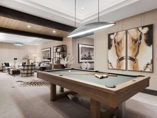 Experience luxury and leisure in this sophisticated game room, featuring a professional billiard table and stylish seating areas.