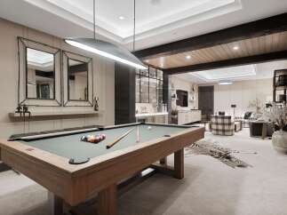 Experience ultimate relaxation and entertainment in this luxurious game room, featuring a professional billiard table and a stylish lounge area.