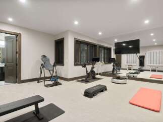 Transform your home into a personal fitness sanctuary with this fully equipped gym.