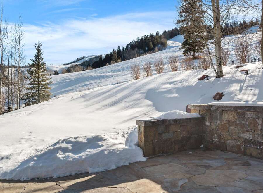 Experience the ultimate mountain lifestyle with this stunning property offering breathtaking views of snow-covered slopes and pristine wilderness.